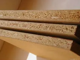 Particle-board core under a veneer skin
