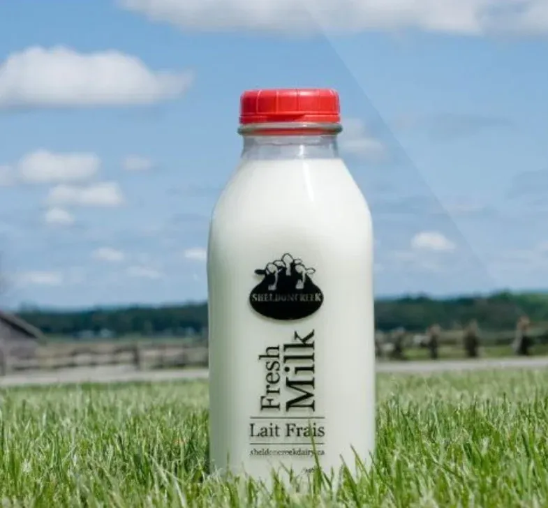 Fresh whole milk and produce on a local farm stand
