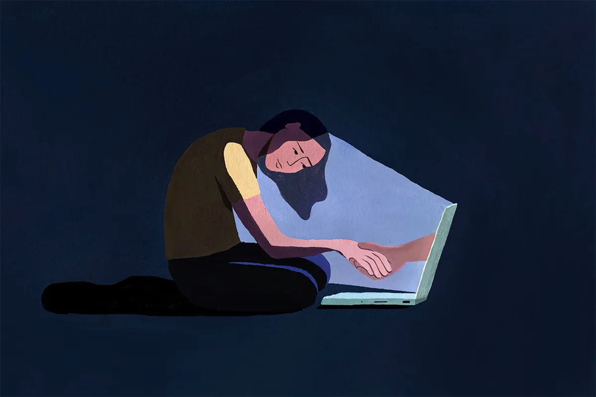 Person isolated with phone in low light